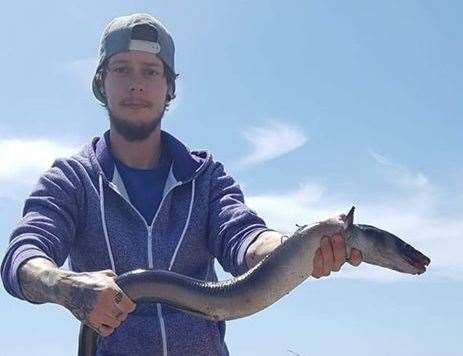 Danny Farrant with a congor eel landed at Samphire Hoe