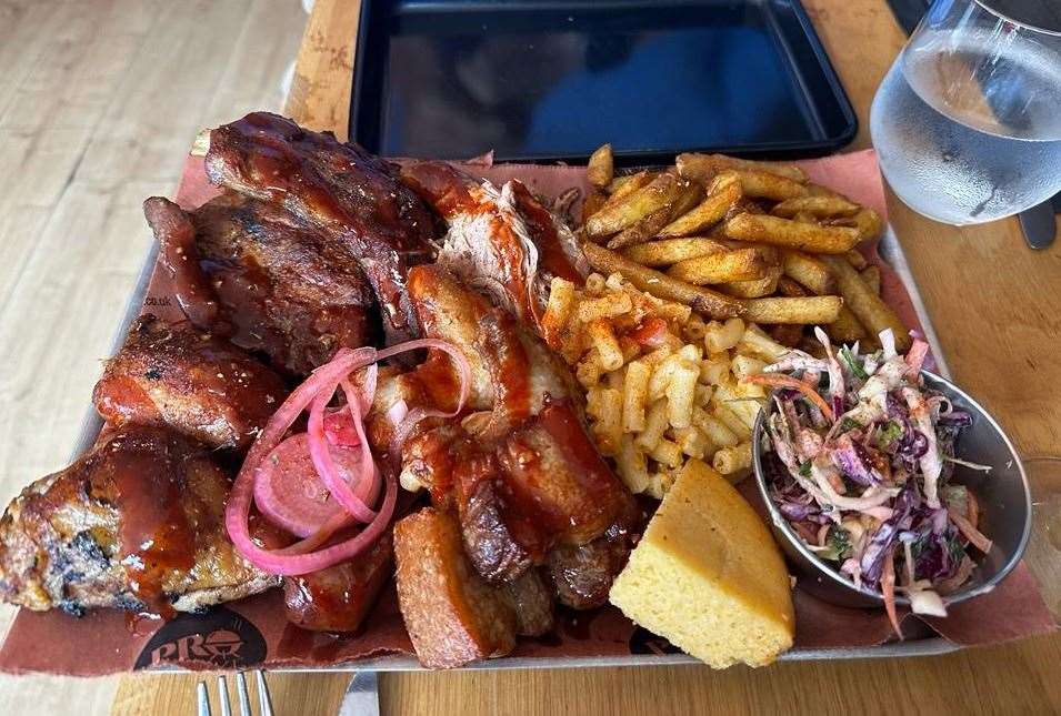 The platter had an array of meats and sides