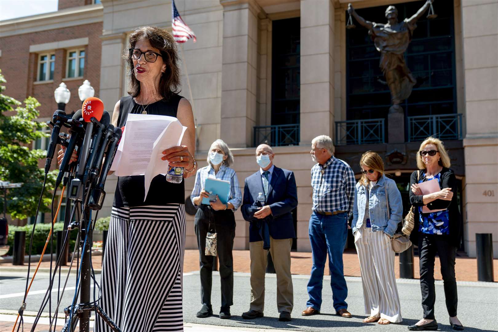 Ms Foley was joined outside the court by members of other victims’ families (Andrew Harnik/AP)