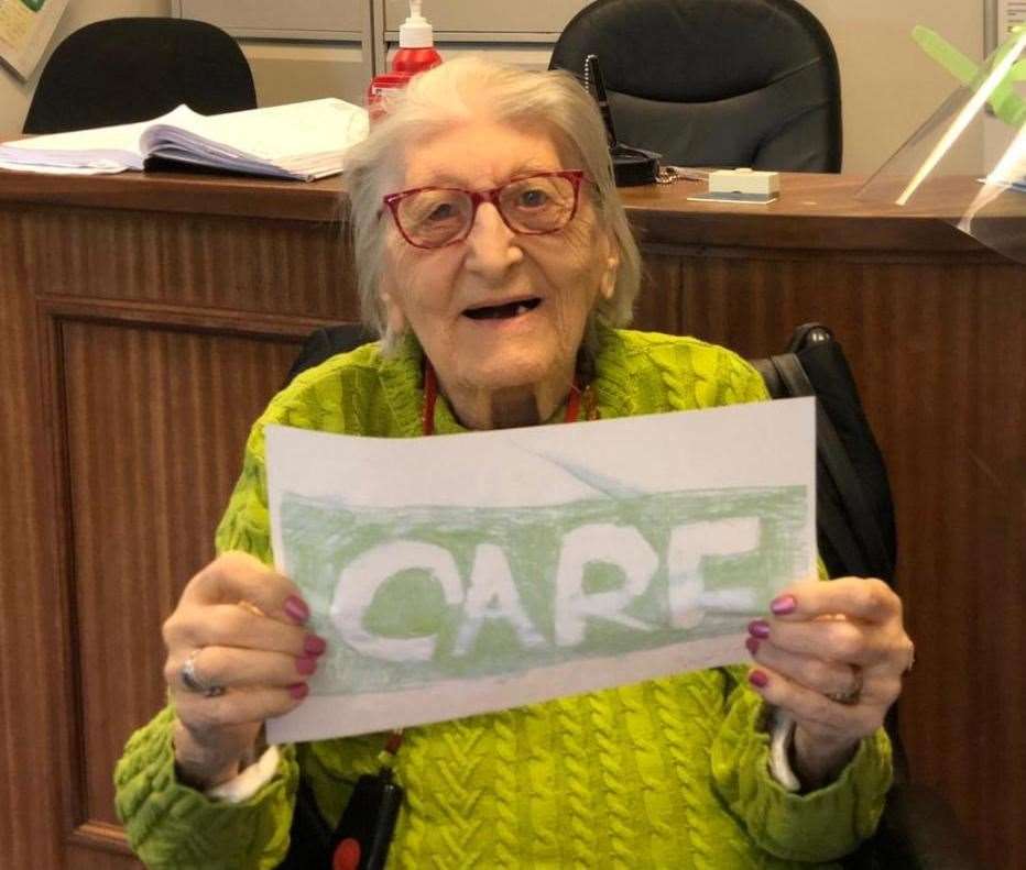 Hazel, 99, with the card she designed. Picture: Kevin D'Lima