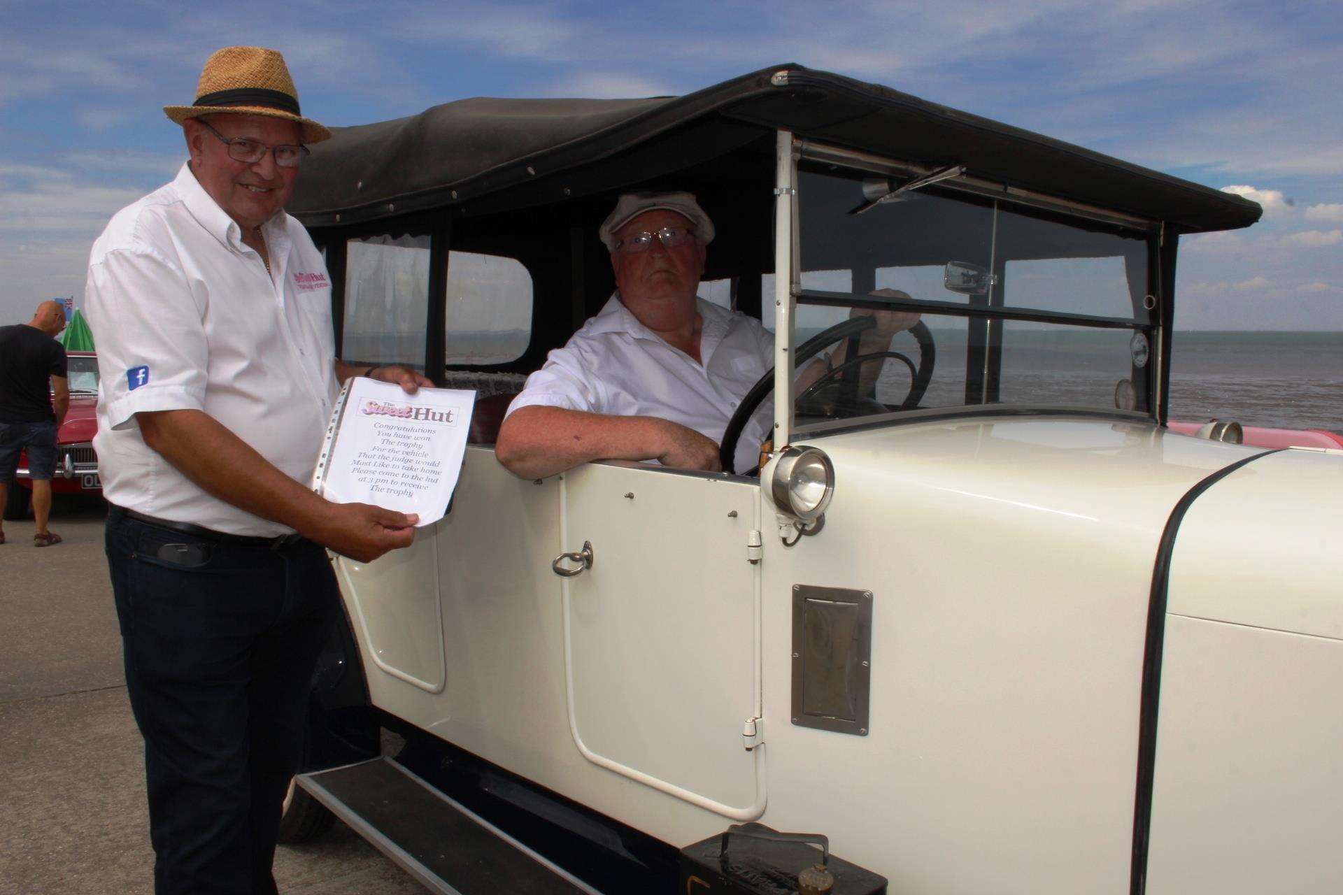 Paul Weeks tells Sittingbourne collector Barry Lowdell his 1928 Austin was the best car on show on the Sheppey seafront at Minster Leas on Sunday (3206602)
