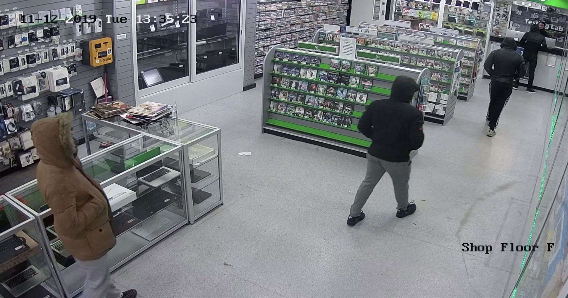 One man jumped over the counter and pushed a member of staff and stole the phones