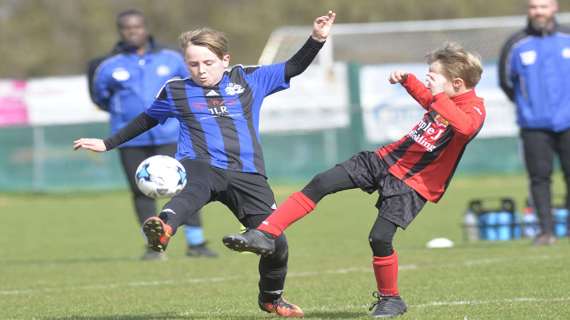 Omega 92, left, and Woodcoombe Youth battle it out in their Under-9 Trophy final Picture: Ruth Cuerden