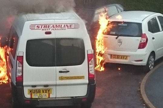 Flames from the taxi spread to two parked cars. Picture: Diane Hayman