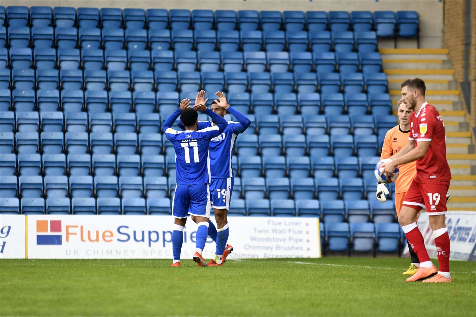 Trae Coyle celebrates their second goal infront of an empty stand Picture: Barry Goodwin