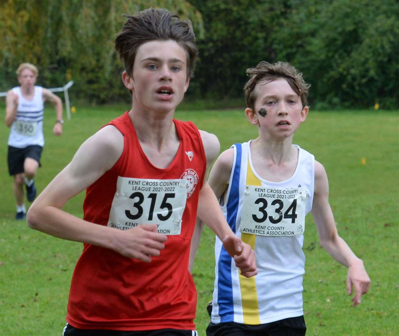 No.315 Roddy Ostle (Invicta East Kent AC) and 334 Andrew Simmons (Sevenoaks AC) during the under-15 boys' race. Picture: Chris Davey (52348037)