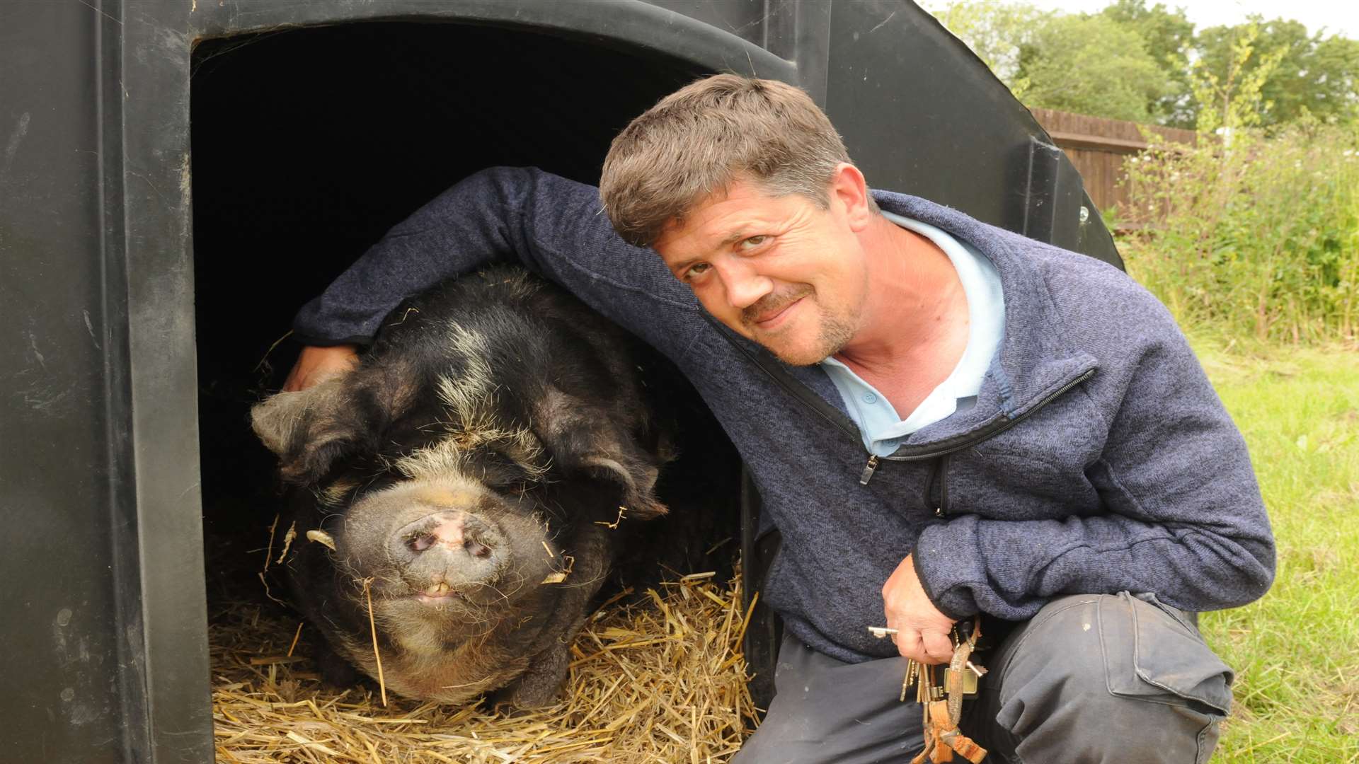 Andy Cowell with Spice the kune kune pig. Picture: Steve Crispe