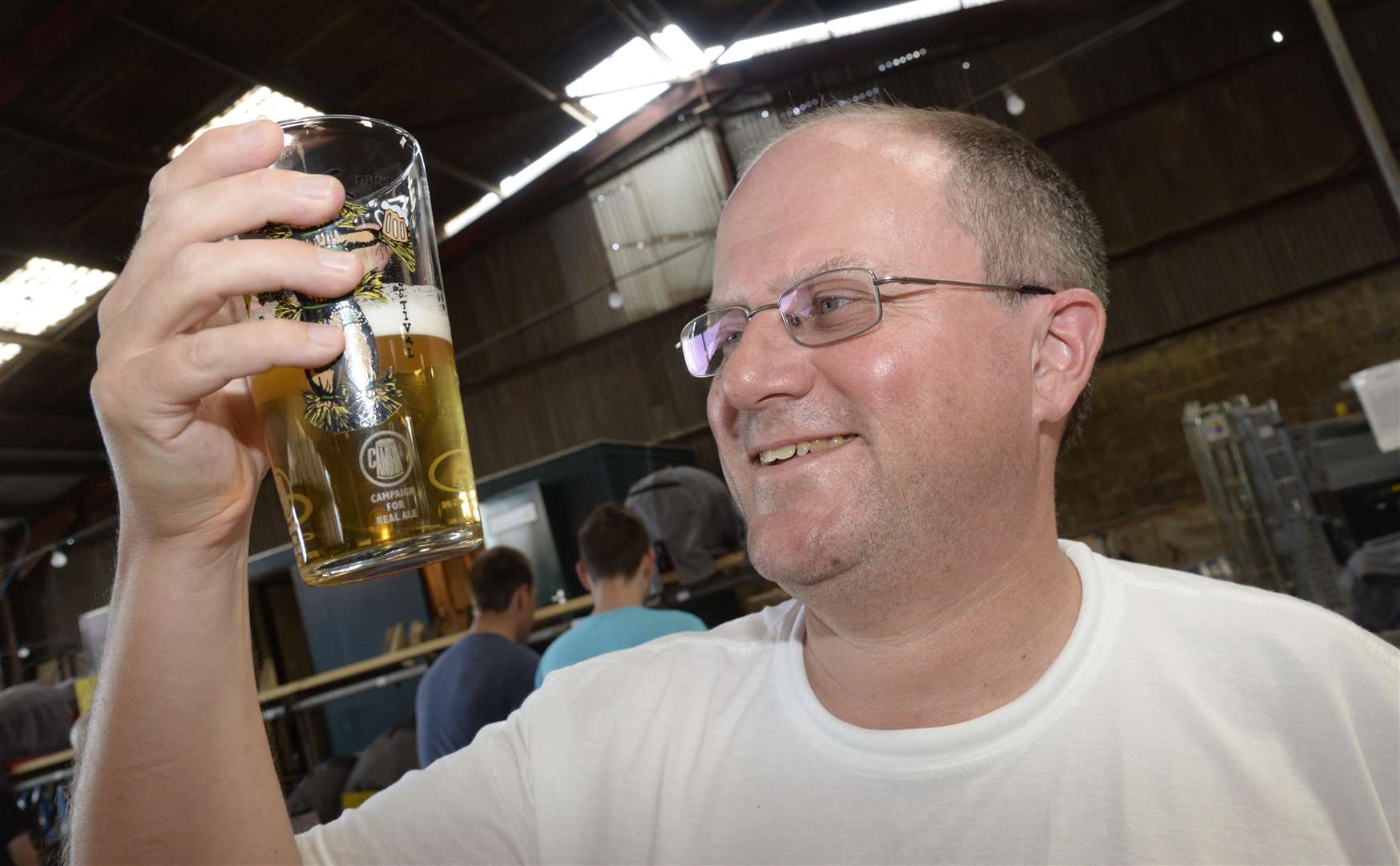 Geoffrey Samme samples a glass of Oakham light bitter at a previous festival Picture: Chris Davey
