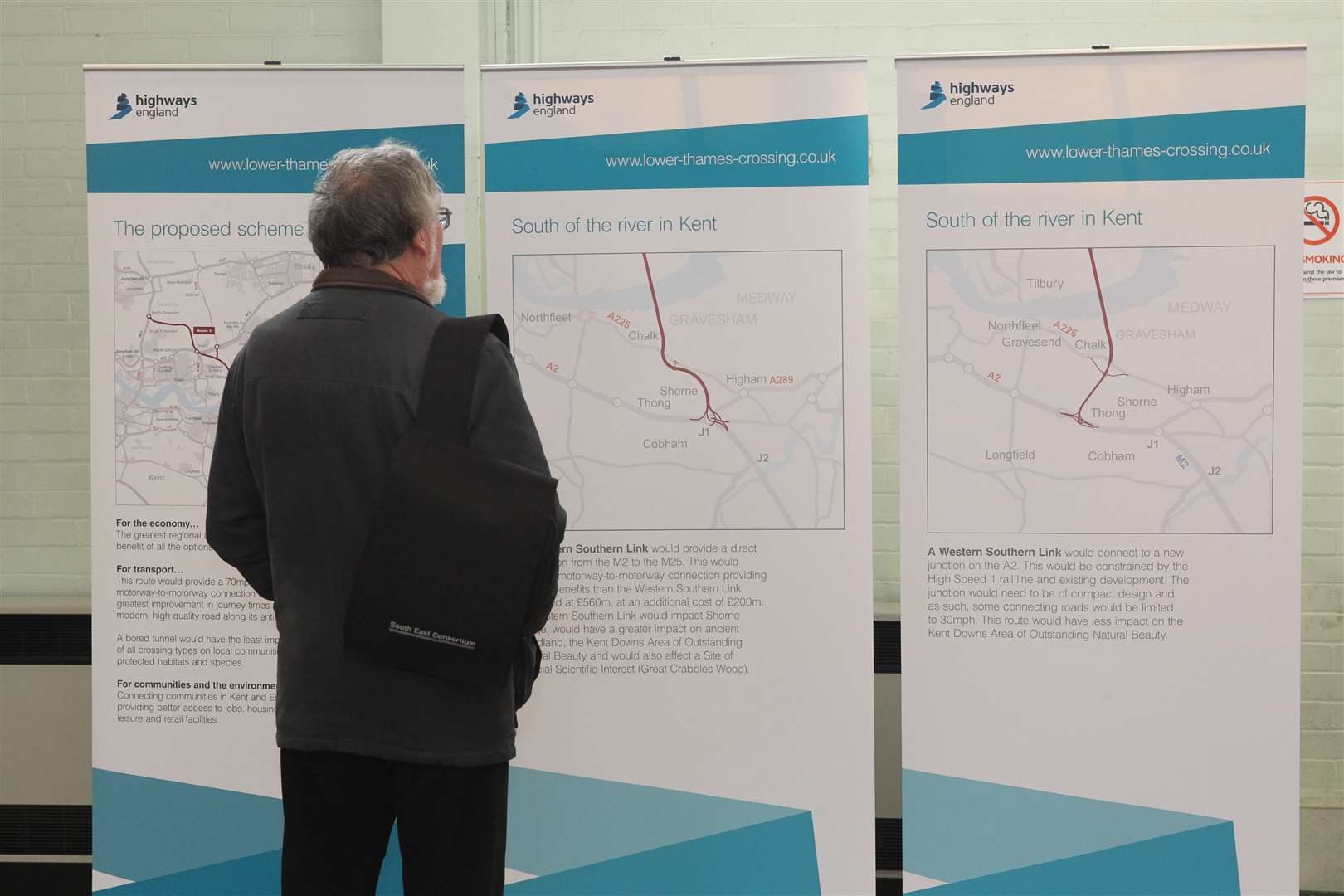 A man looks at the Lower Thames Crossing plans.