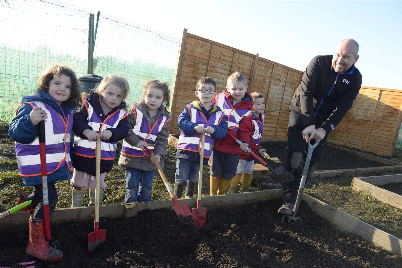 Sky manager Pete Stephenson enlists the help of pupils from the nursery school as works on the Bright Sparks Nursery allotment in Church Lane, Deal