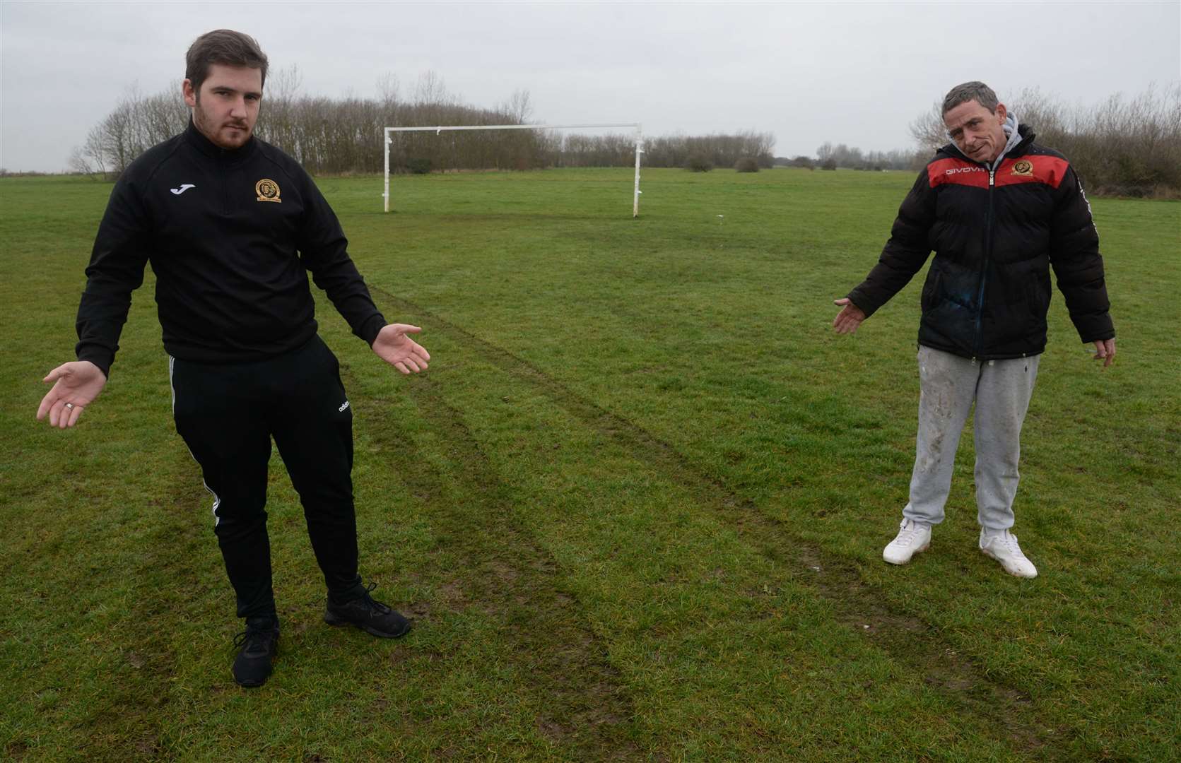 Manager Charles Osmond, groundsman John Osmond and the damage to the Leysdown FC football pitch in Shellness Road. Picture: Chris Davey