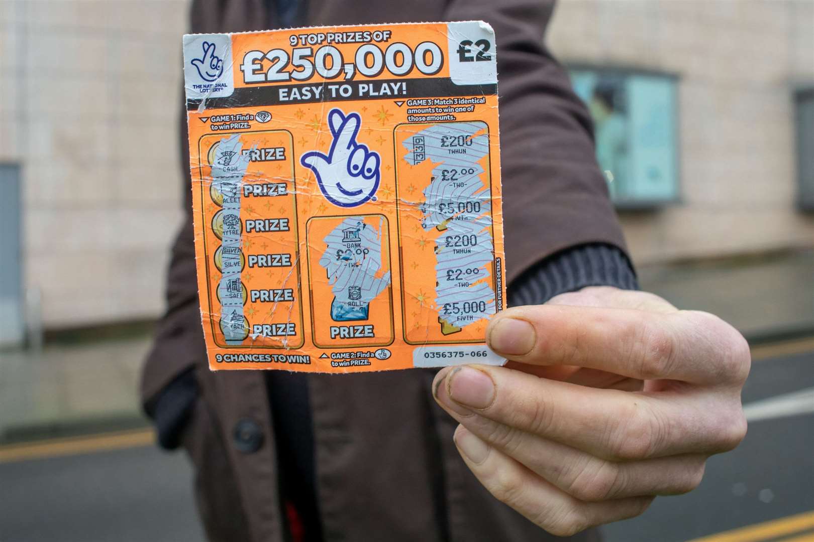 The scratchcard Ronnie, seven, bought in August. Picture: SWNS