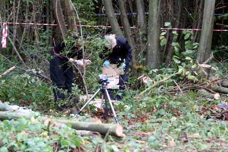 Police officers searching for clues at the scene of the discovery last month. Picture: ANDY BARNES