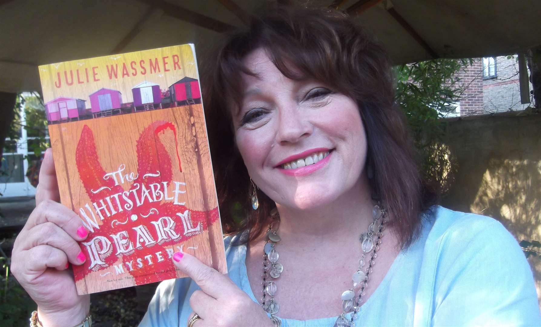 Julie Wassmer with her book The Whitstable Pearl Mystery, which is being turned into a television series