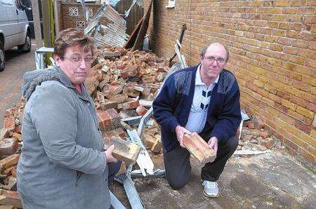 Alan and Wedy Jacques outside their house, which was damaged in the high winds on New Years eve. The chimney fell down on the car port.