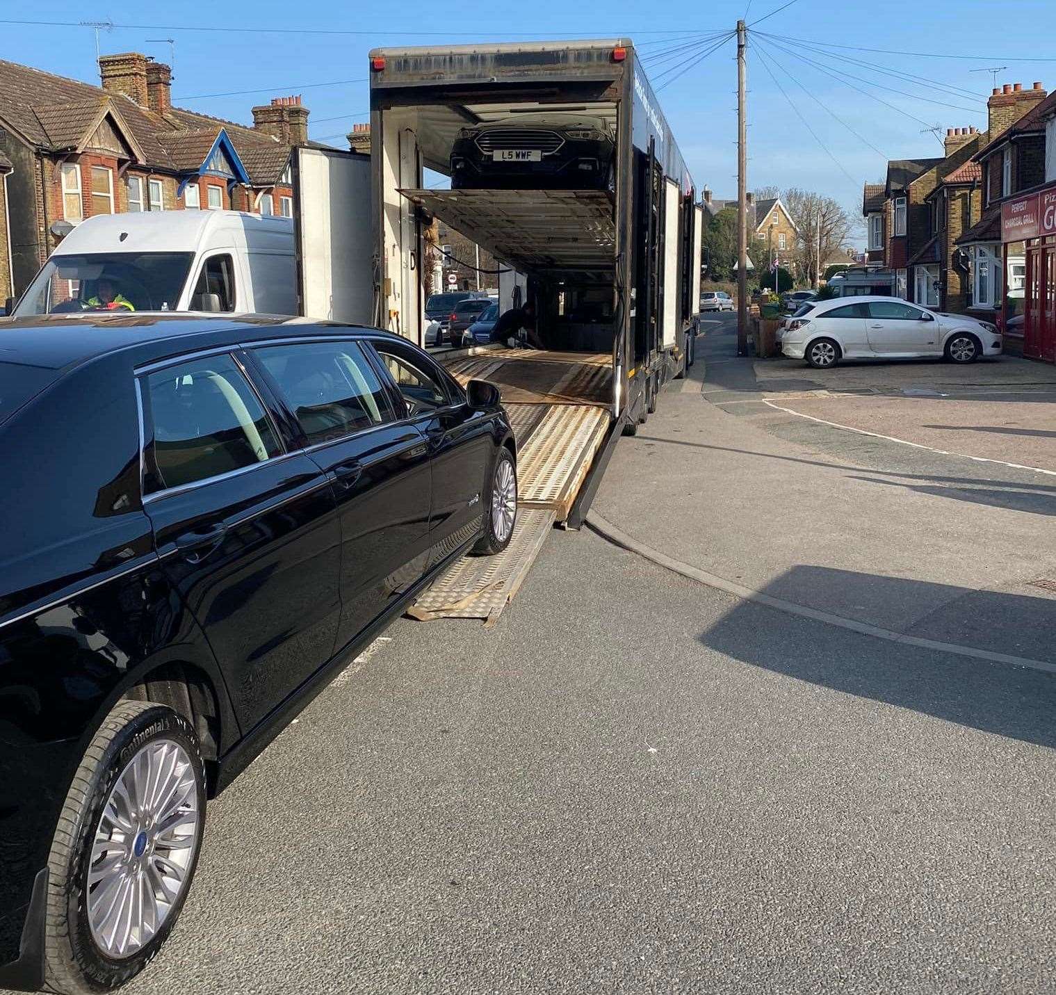 Unloading a new fleet of hybrid limousines and hearse for Sittingbourne firm William Whitmey Funeral Directors