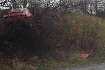The vehicle sits precariously up a grass bank on the A2. Picture: Paul Browning