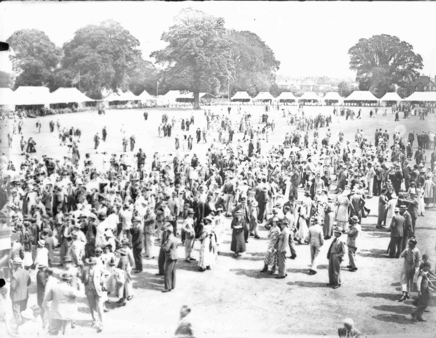 Cricket week at the St Lawrence Ground in 1933. It is held the first week in August and always a popular social affair. Here, crowds gather against a backdrop of tents lining the ground, which was opened in 1847. File picture used in 'Images of Canterbury' book