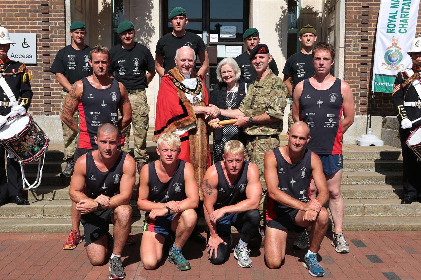 Mayor of Tunbridge Wells, Councillor Julian Stanyer meets members of Her Majesty's Royal Marines as they do a baton handover on their 1664 Challenge which brings them to the borough