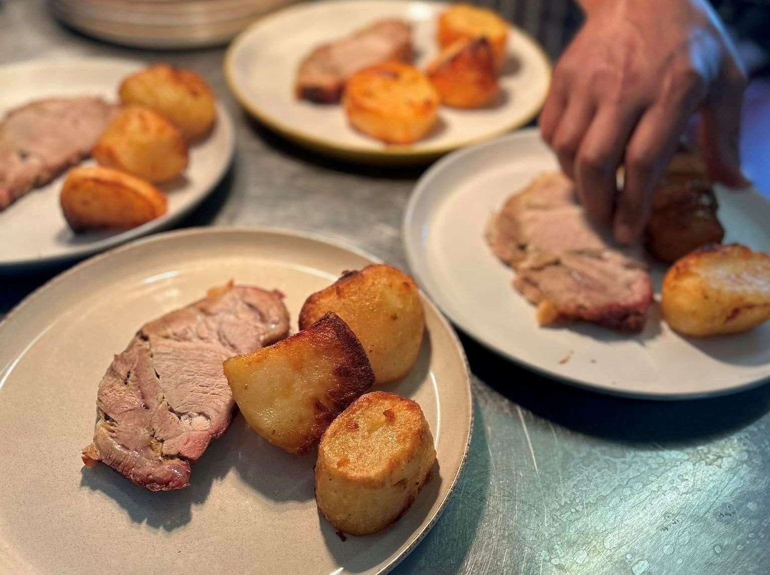 Plating up the roast dinners at The Queens Head