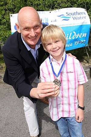 Tom Narborough, eight, was presented with his Southern Water Learn to Swim Achiever of the Year award by Olympic gold medallist Duncan Goodhew.