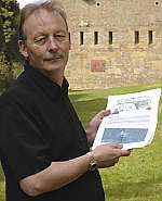 District councillor John Goodwin with the national war memorial proposals. Picture: Terry Scott