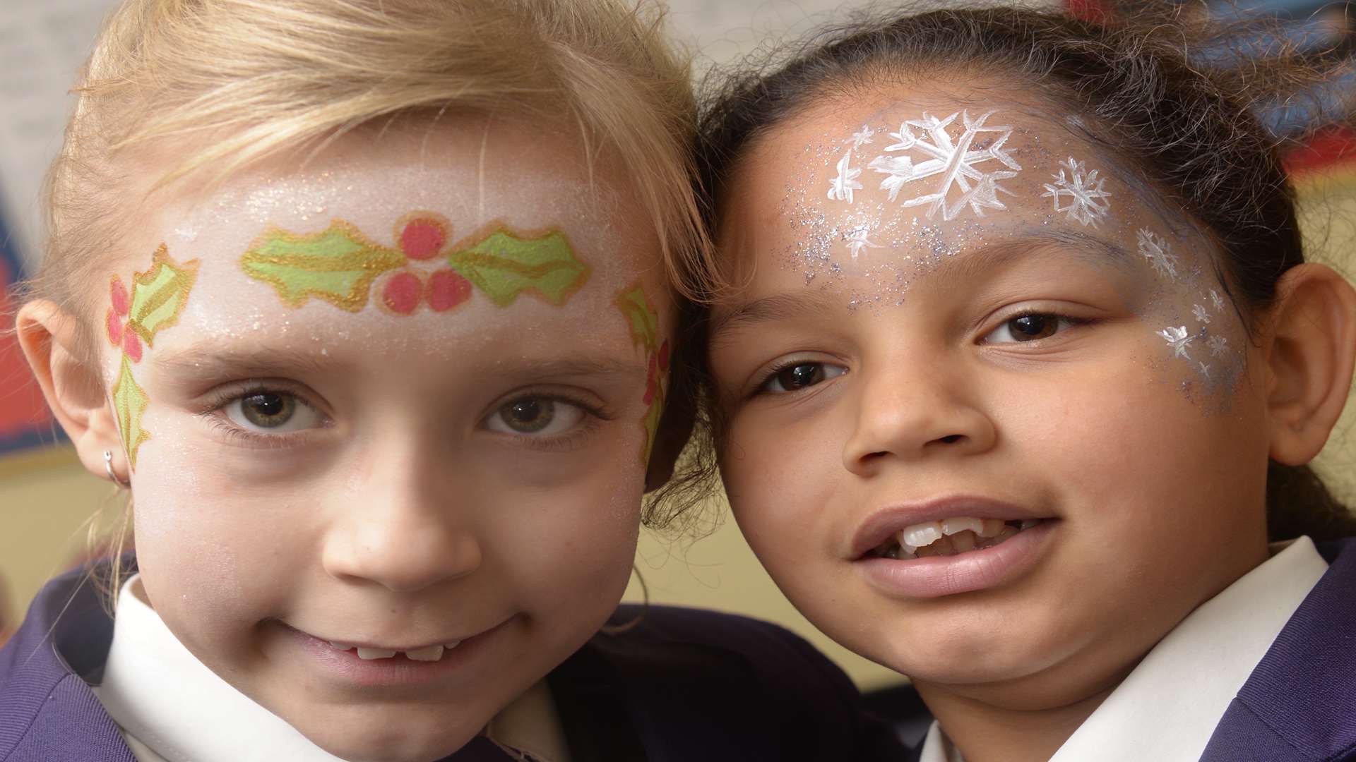 Shannen Rogers and Aaliyah Henry, both nine, with their painted faces at Richmond Academy Christmas Fair.