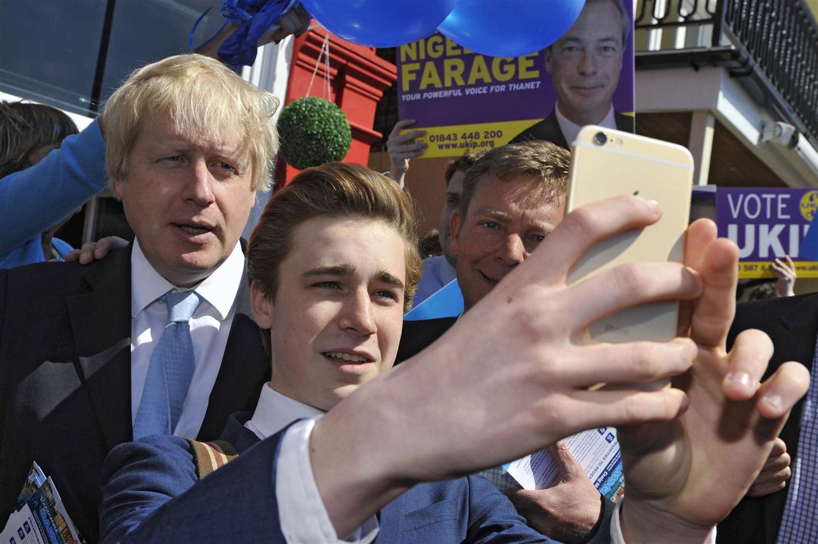 A school pupil gets a selfie with Boris Johnson and Craig Mackinlay on the 2015 General Election campaign trail