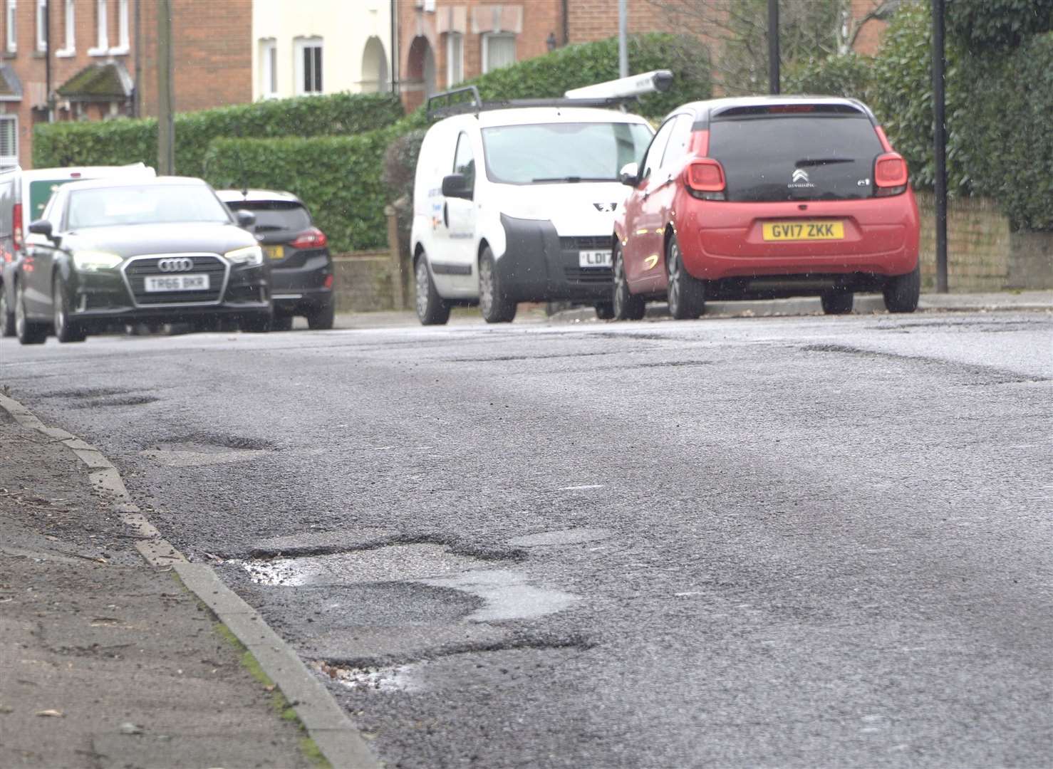 Potholes cover Beacon Oak Road in Tenterden