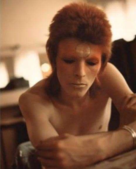 A pensive David Bowie backstage with his Ziggy make-up at the Hammersmith Odeon in 1973