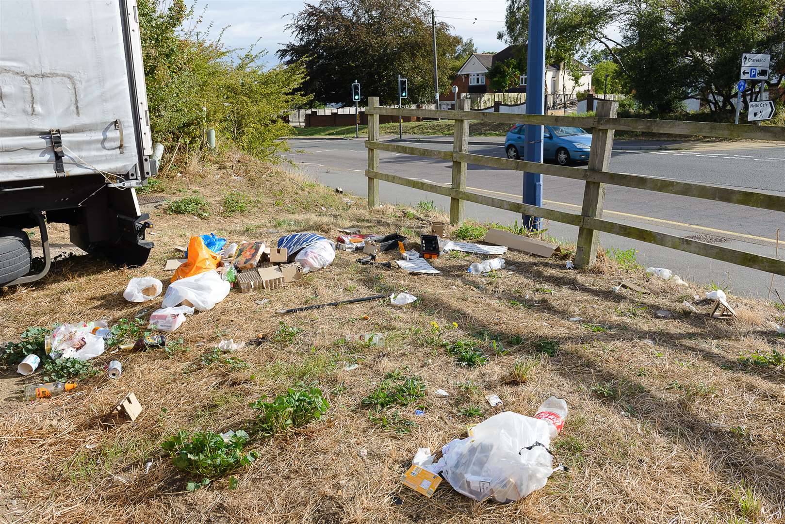 View of rubbish discarded at lorry park opposite Nell's Cafe