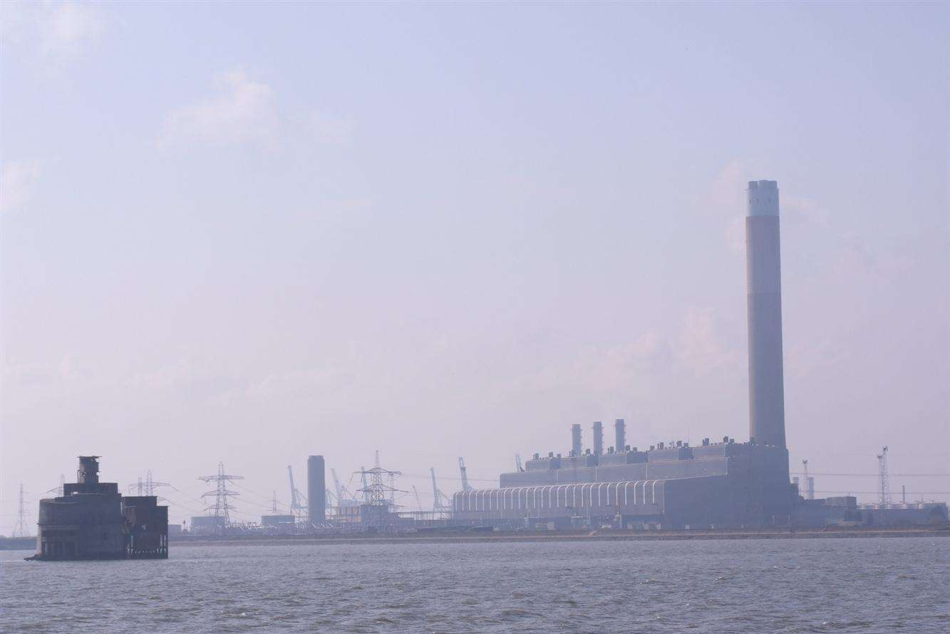 The Isle of Grain from the Medway estuary showing Grain Tower (left) and Grain power station (right).