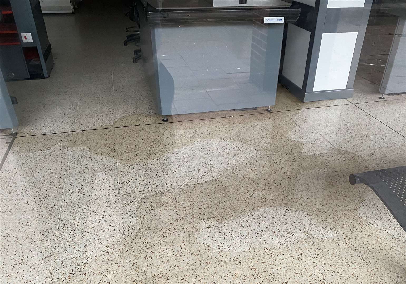 The water can be seen flowing under the till cabinets