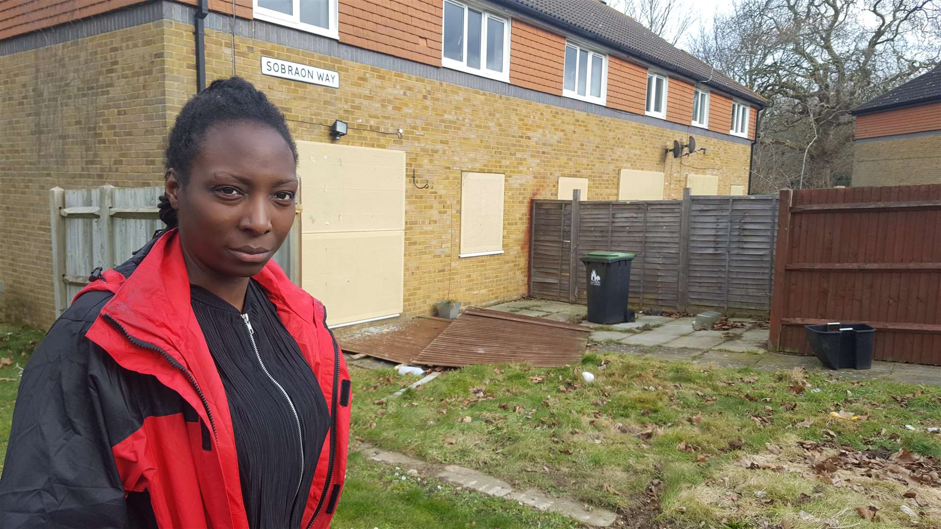 Natalie Mbbunga outside the boarded up former army homes in Sobraon Way, Canterbury
