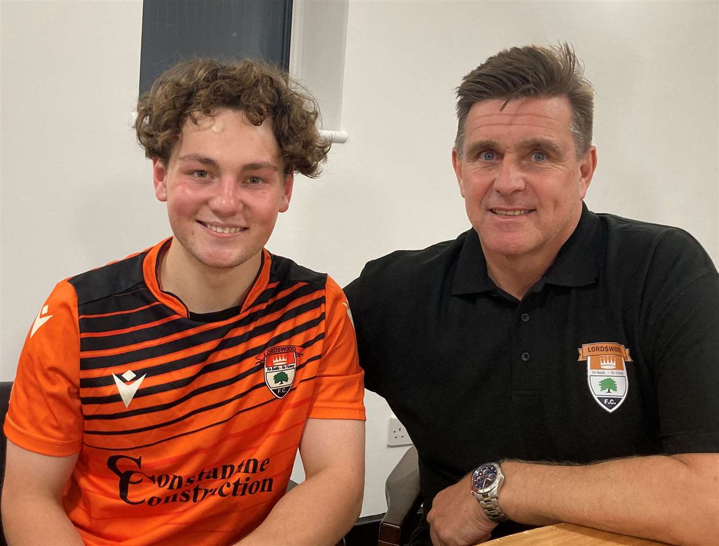Ukrainian teenager Artem Kuchkov is playing for Lordswood Football Club after leaving his home in Kharkiv. Pictured with the director of football Jason Lillis
