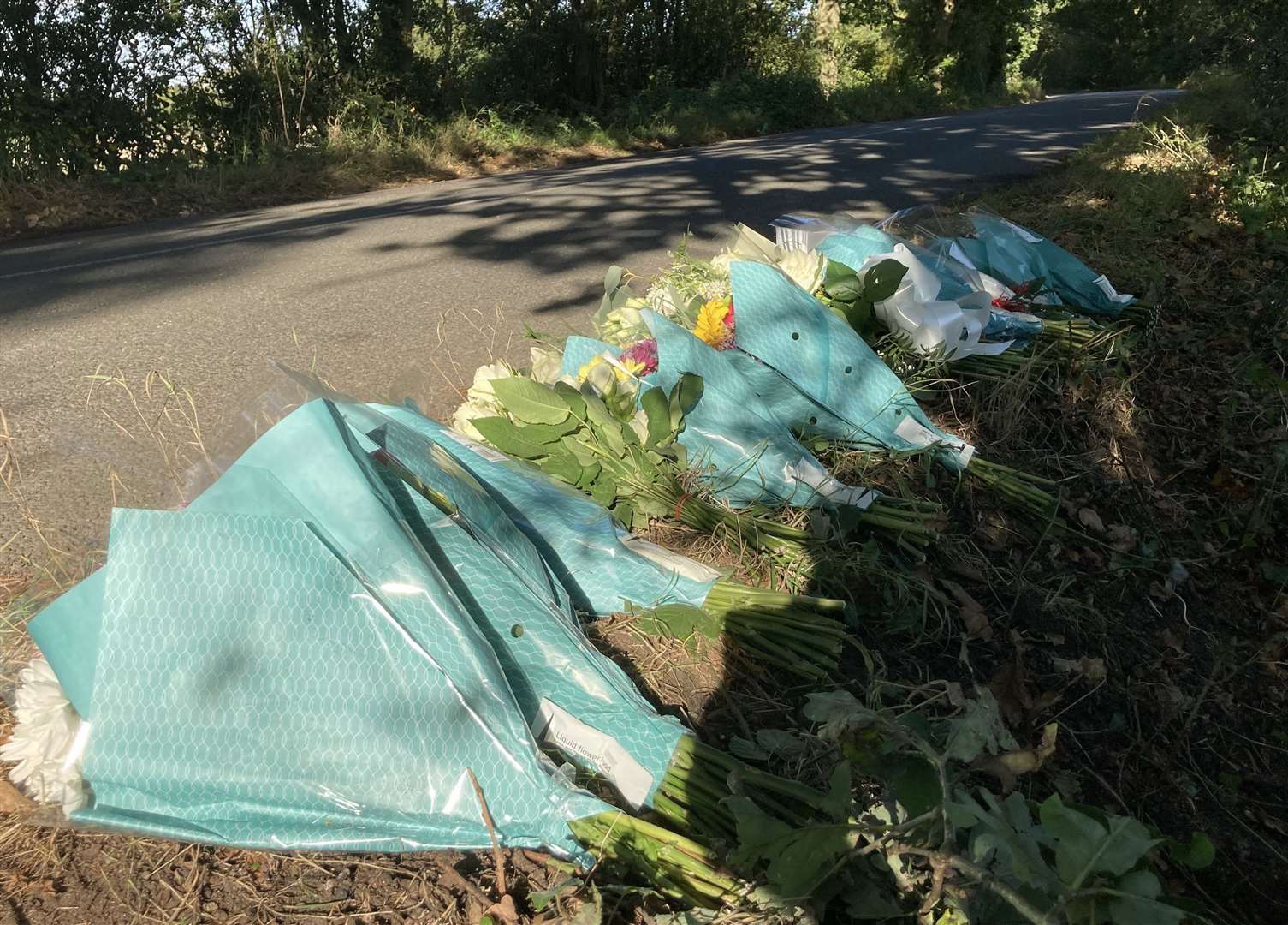 Floral tributes left along Lenham Road, Headcorn in memory of four members men who passed away after a crash. Jerry Cash, 15, is the sole survivor