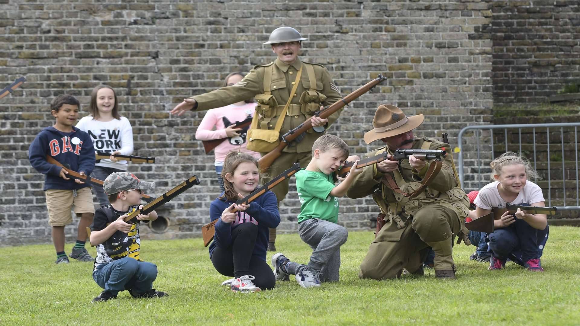 Children in a mock drill led by First World War re-enactors