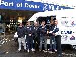 The British Bobsleigh team receive the safety kits from Peter Layton of Travelspot.