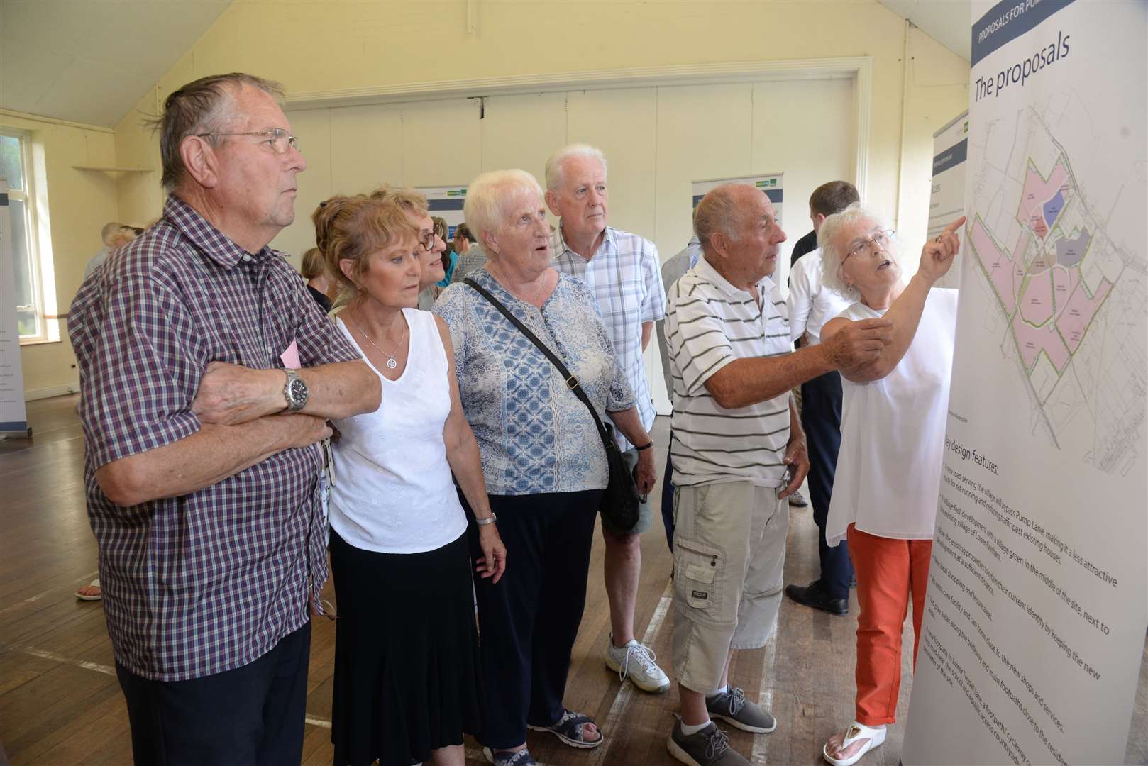 Local residents view the plans at the Pump Lane development consultation in Holy Trinity Church Hall, Twydall on Friday. Picture: Chris Davey. (13735036)