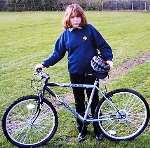 A pupil of Orchard School with one of the bikes which has now been stolen