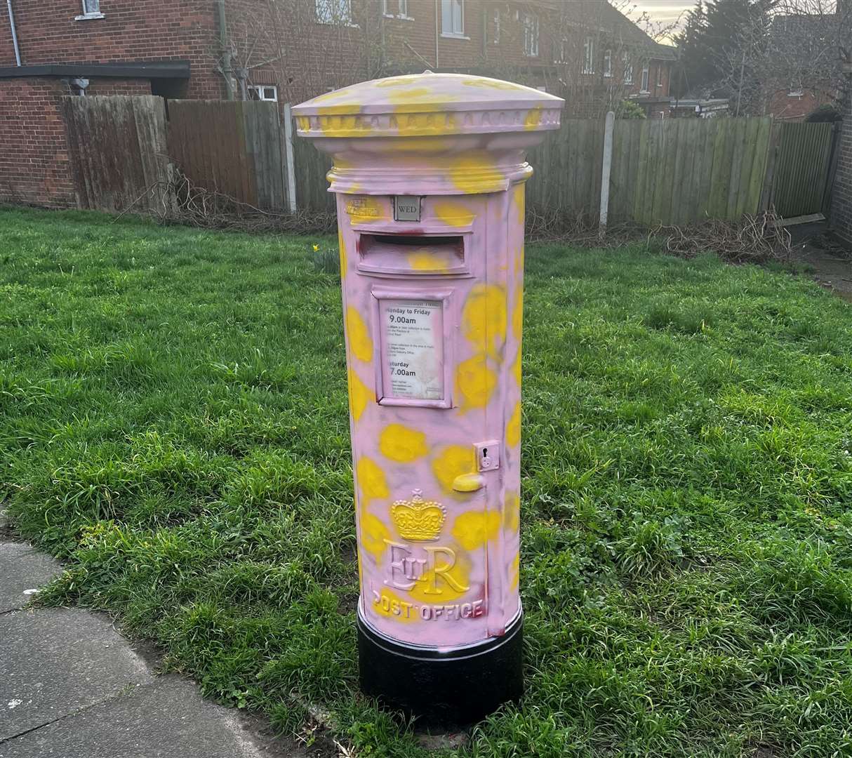 A pink and yellow spotted post box in Trevithick Drive in Temple Hill, Dartford