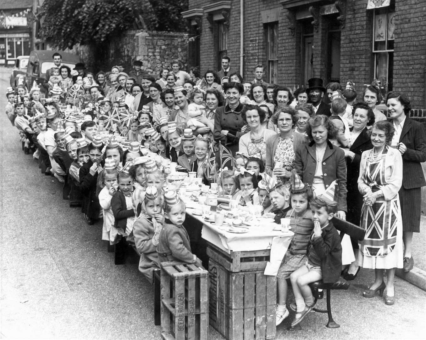 The youngsters of Perryfield Street, Maidstone, sat down to a slap-up tea as part of their coronation celebrations in June 1953