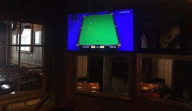 Different screens around the pub were showing different channels. A few folks took a moment to glance at Sky Sports in the main bar but no-one was watching the snooker in this back room