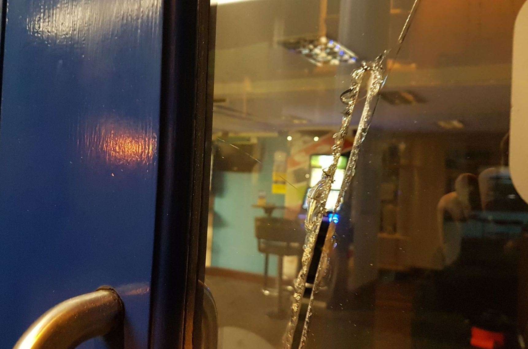 Damage caused to the window of the Coral bookmakers