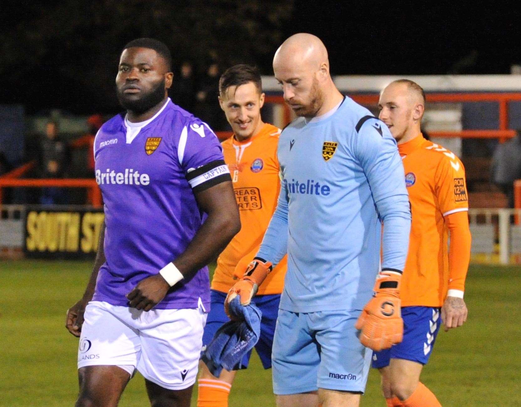 George Elokobi leads out Maidstone at Braintree on Tuesday night Picture: Steve Terrell