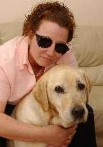 LUCKY: Elton, the guide dog who was mauled, with owner Emma Keen. Picture: JIM RANTELL