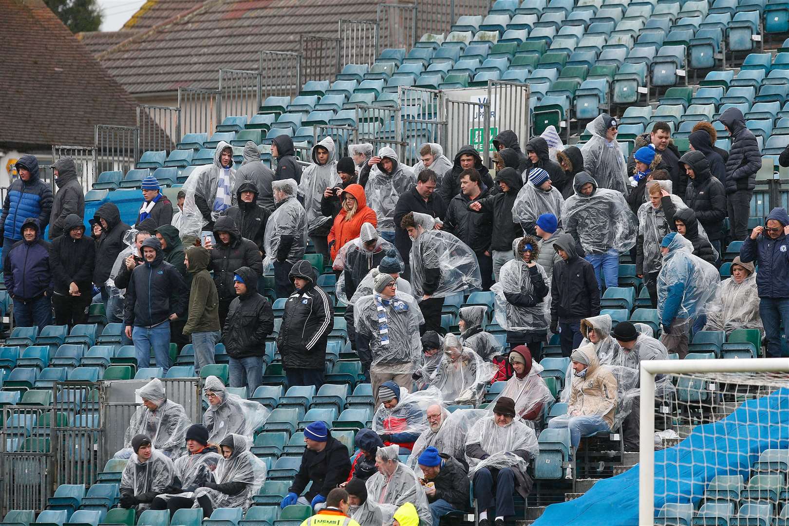 Peterborough United fans brave the rain in the Brian Moore End at Gillingham Picture: Andy Jones