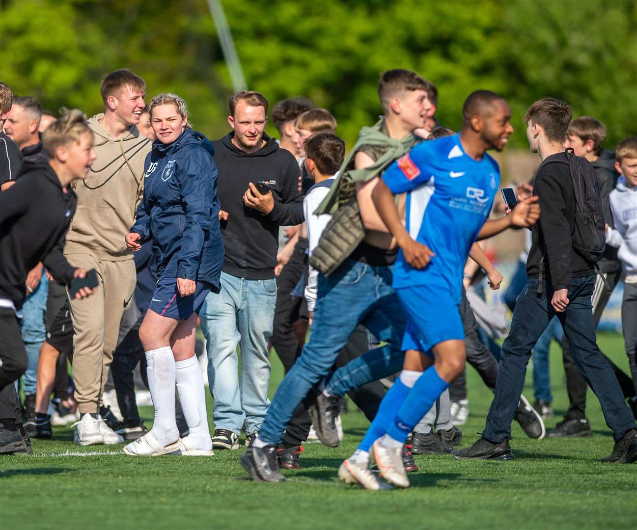 Winger Kieron Campbell, pictured celebrating promotion with fans, will also stay at Winch's Field. Picture: Ian Scammell