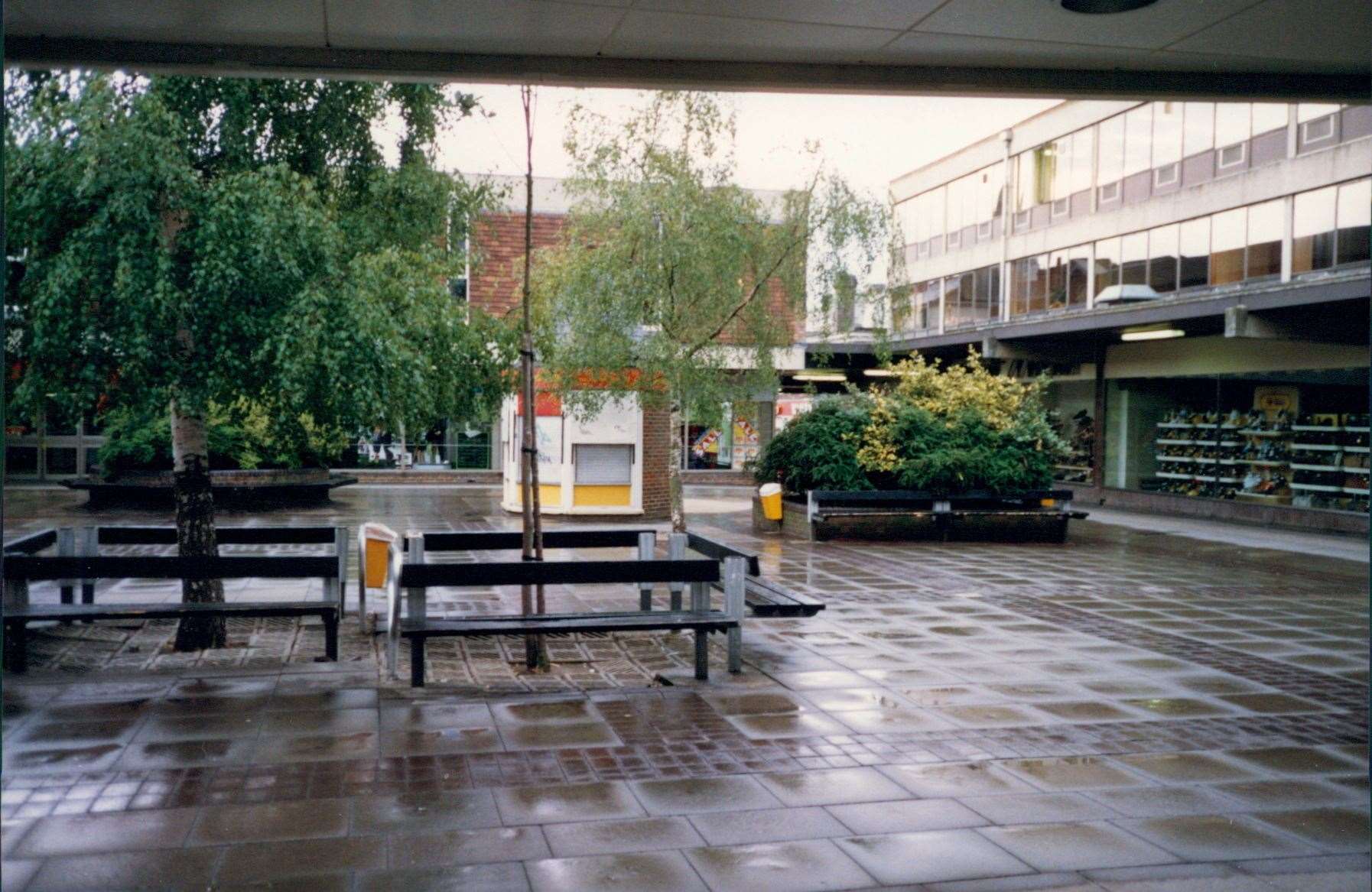 Another view of the Tufton Centre central square taken outside Littlewoods. It shows Peacocks and the Marshall shop beyond the trees and Manfield Shoes on the right. Picture: Steve Salter