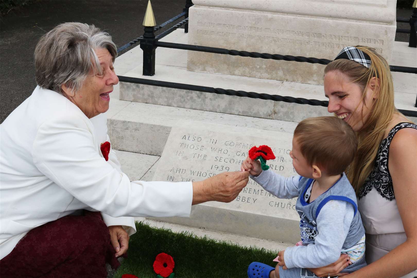 Cllr Sue Gent (left), vice chair of World War One Centenary steering group, with Bentley and Tanita Miller at the Sheerness war memorial in 2017. FM4862808 (7706808)